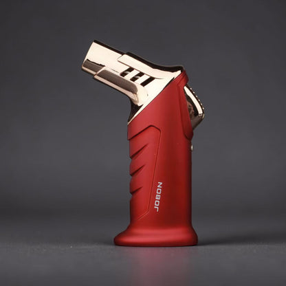 Red and gold lighter on a dark gray background