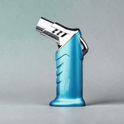 Blue lighter with chrome top on a gray background