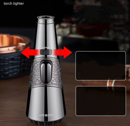 Silver torch lighter with intricate design on a dark background