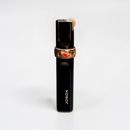 Black and rose gold lighter with 'Jubilee' branding on a white background