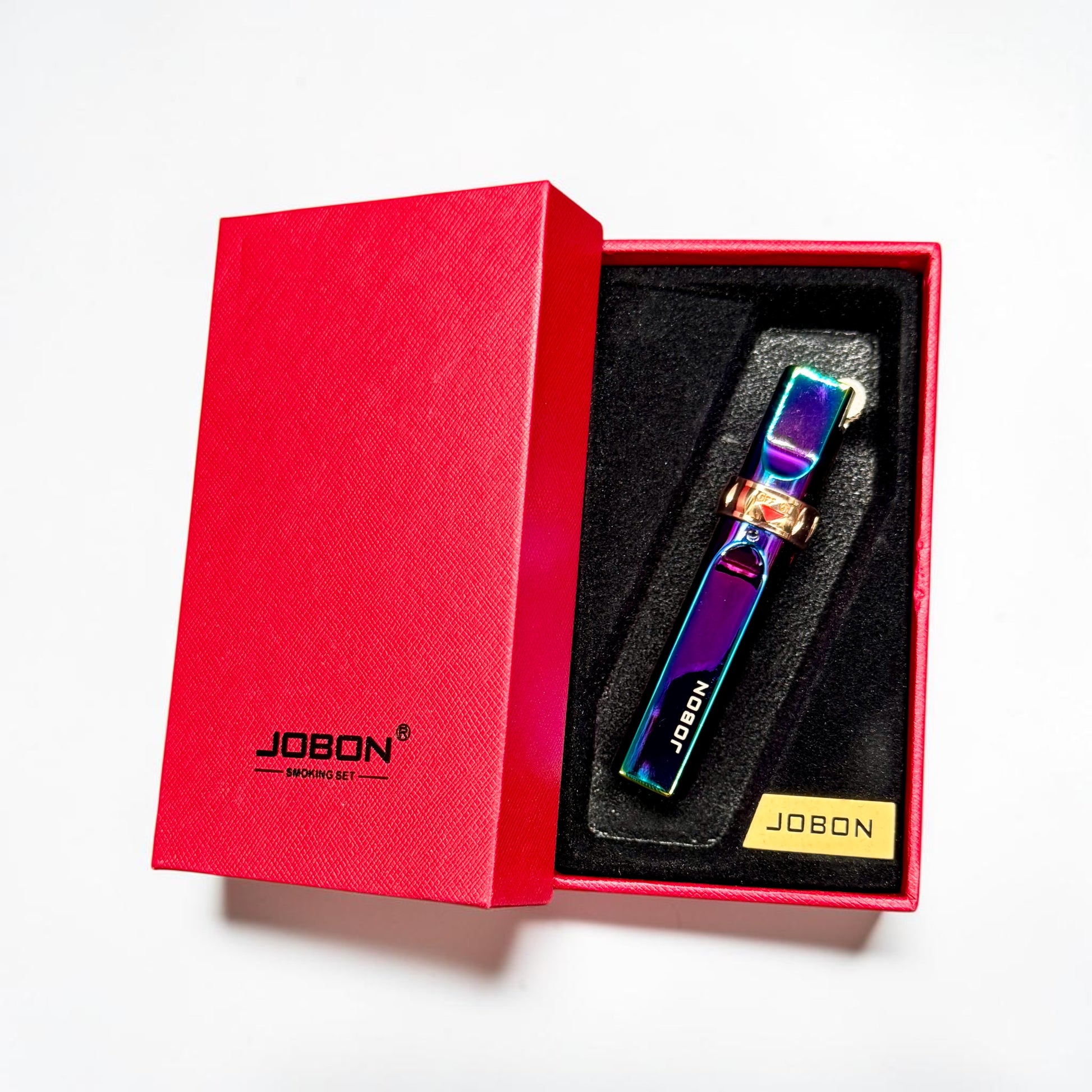 Colorful smoking tool in a red Jobon box on a white background