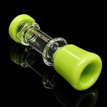 Glass smoking accessory with green rubber gaskets on a black background