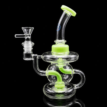 Glass water pipe with green accents on a black background