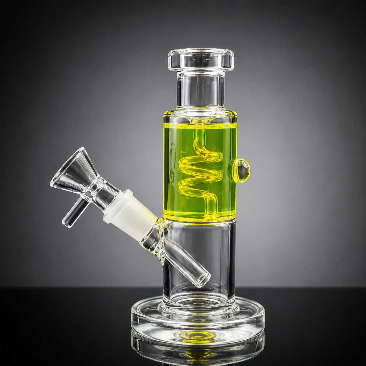 Glass water pipe with green liquid on a dark background