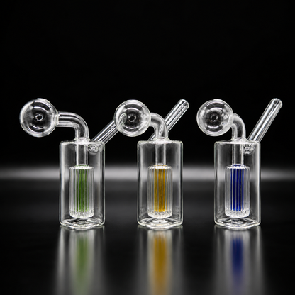 Three glass smoking devices with colored liquids on a black background