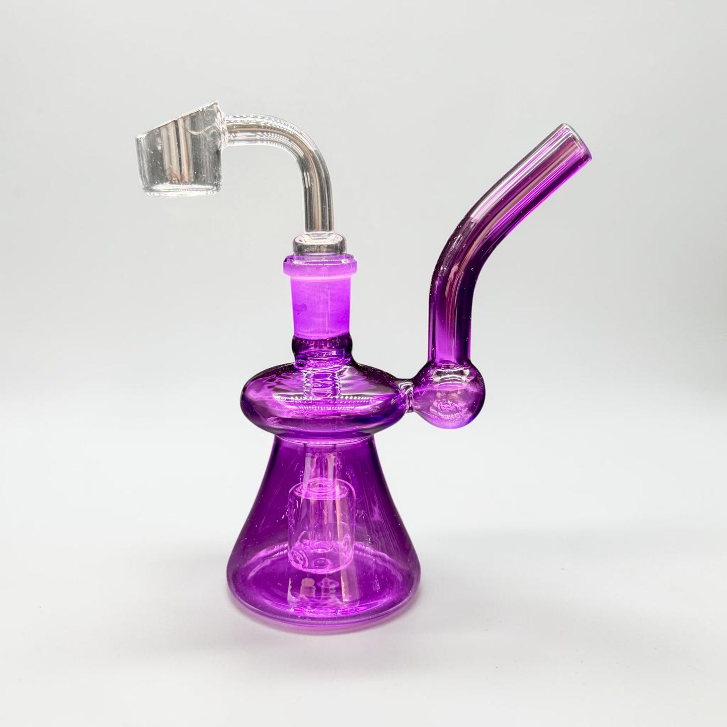 Purple glass smoking device on a white background