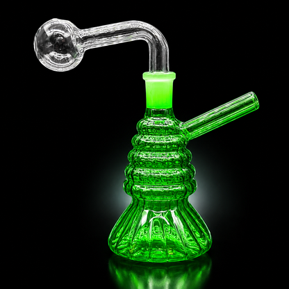 Green glass water pipe on a black background