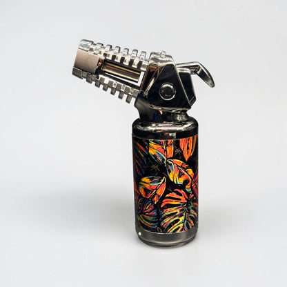 Butane lighter with colorful leaf pattern on a white background