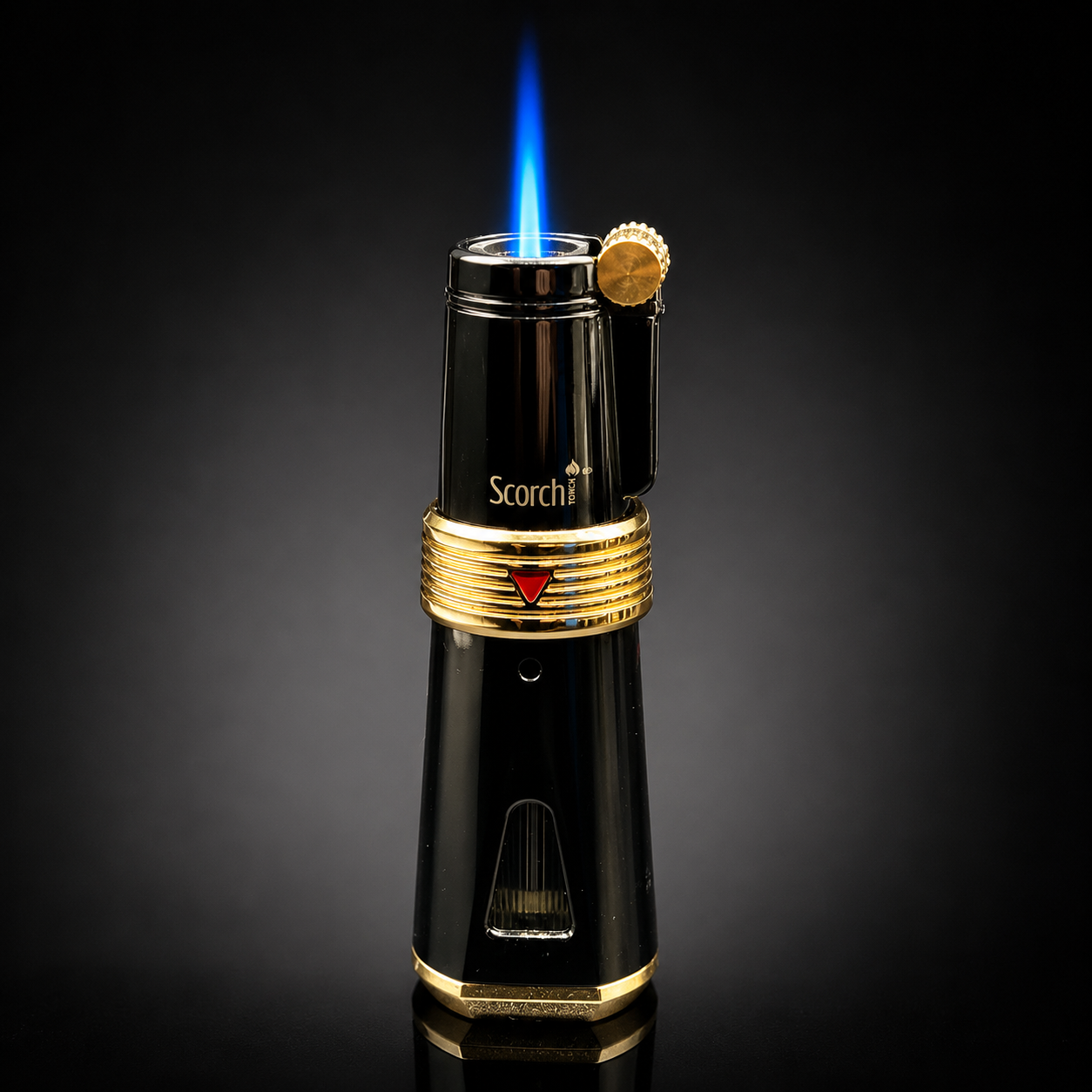 Black and gold lighter with blue flame on a dark background