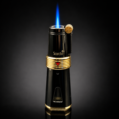 Black and gold lighter with blue flame on a dark background