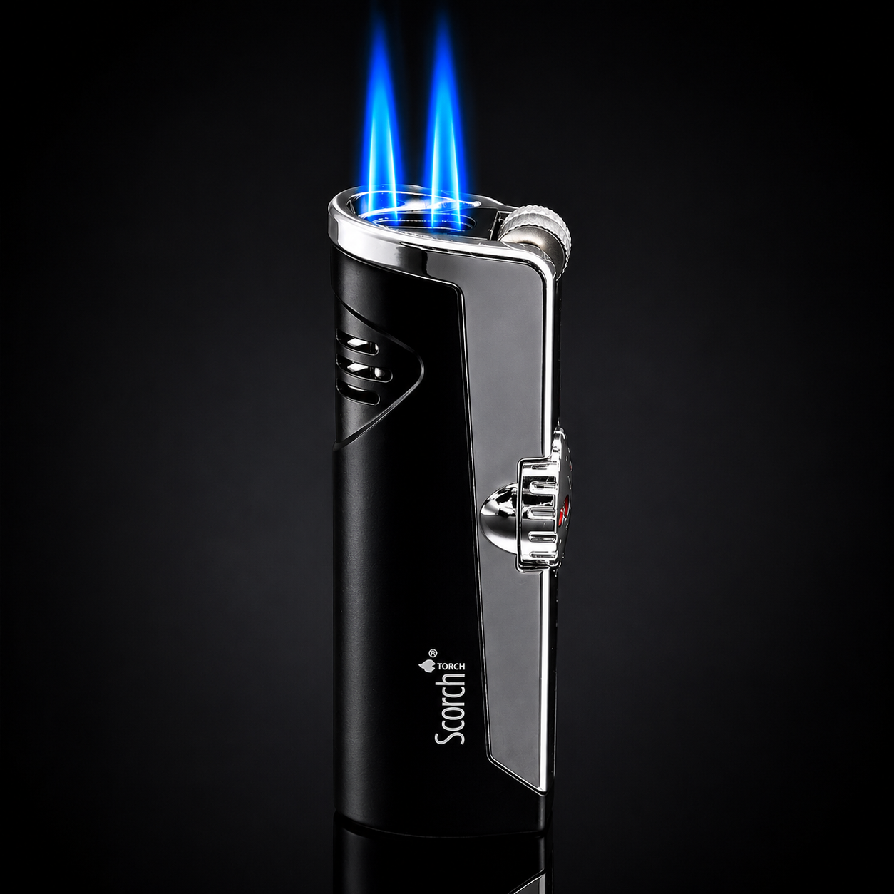 Black and silver lighter with blue flame on a black background