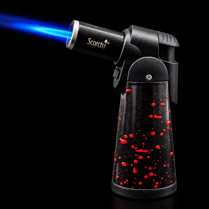 Butane torch with blue flame on a black background, featuring the Scorch brand.