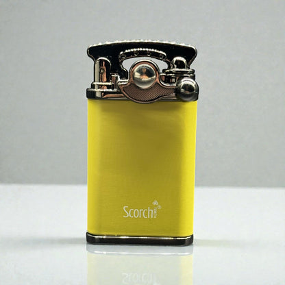 A yellow Scorch portable lighter with a brushed metal top and silver accents, standing upright on a reflective white surface against a gray background.