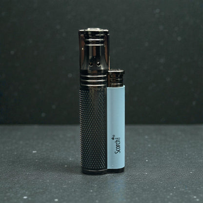 A dual lighter set featuring a black textured lighter and a smaller black lighter with a light blue body, both branded with 'Scordi', set against a dark gray background.