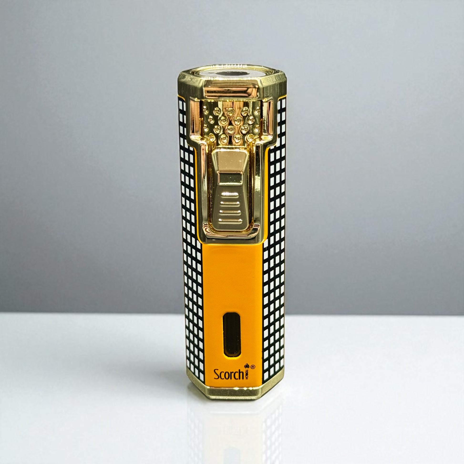 Gold and black lighter with 'Scorch' branding on a gray background
