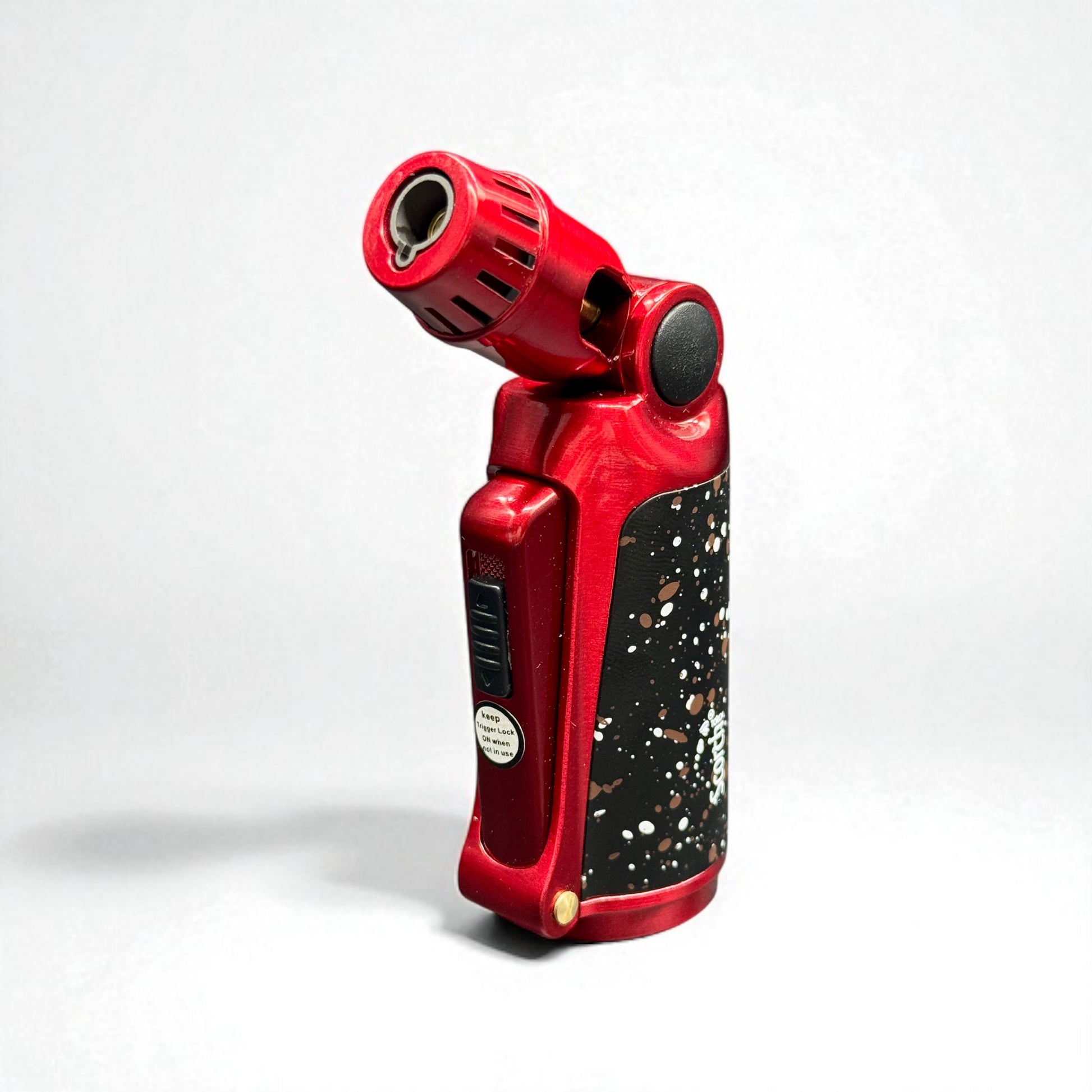 Red and black handheld lighter on a white background