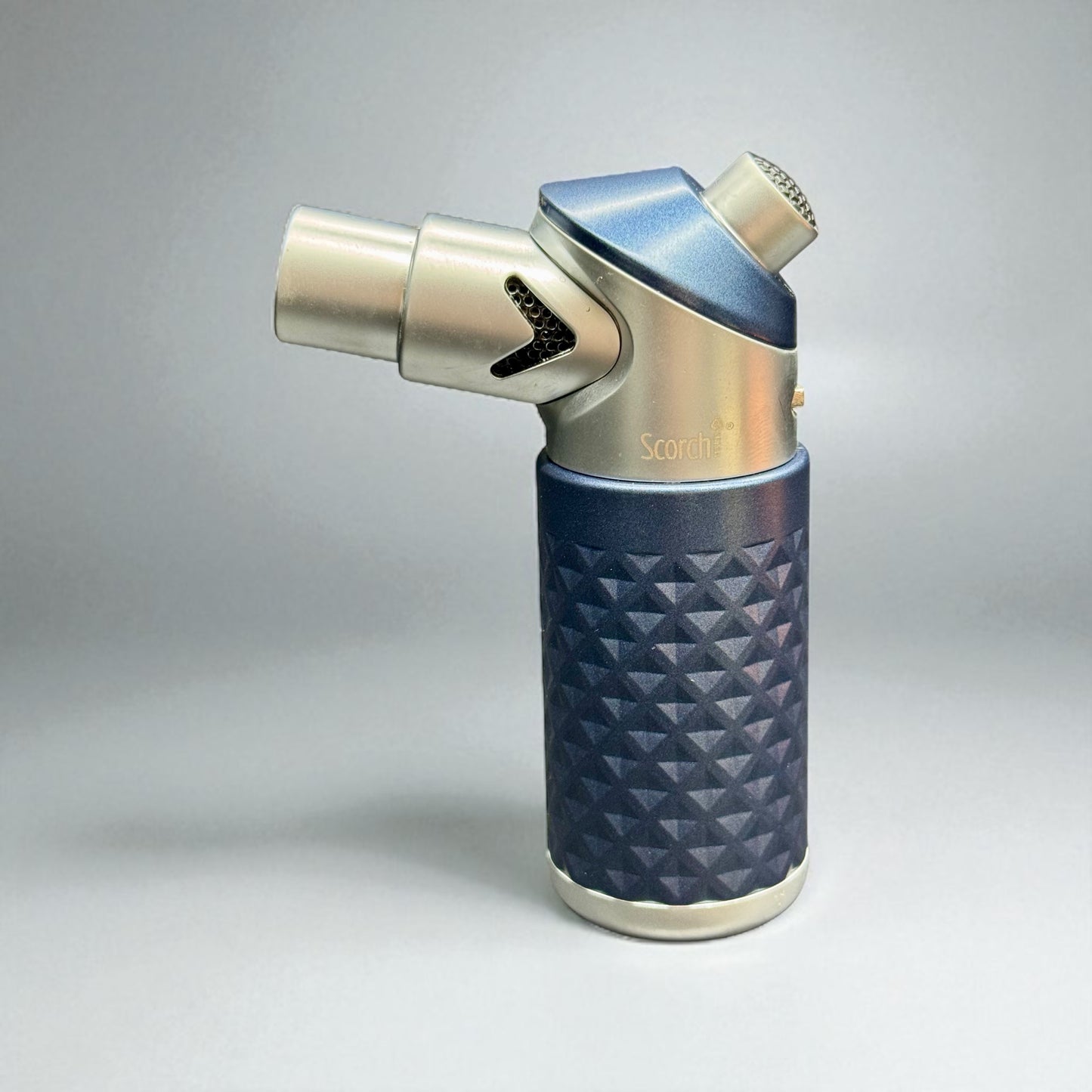 Butane lighter with blue textured grip and metallic accents on a gray background