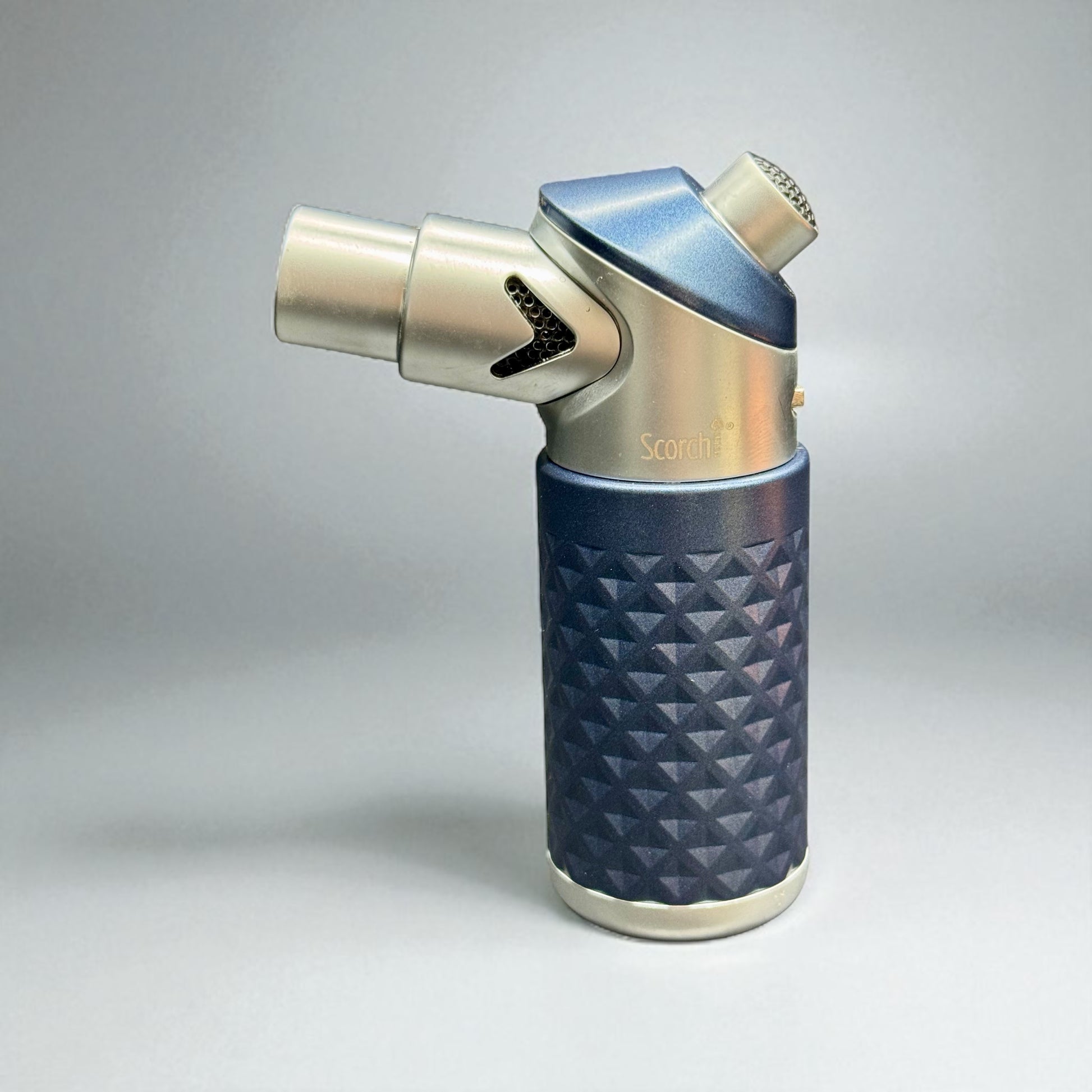 Butane lighter with blue textured grip and metallic accents on a gray background