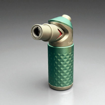 Green and silver butane lighter on a gray background