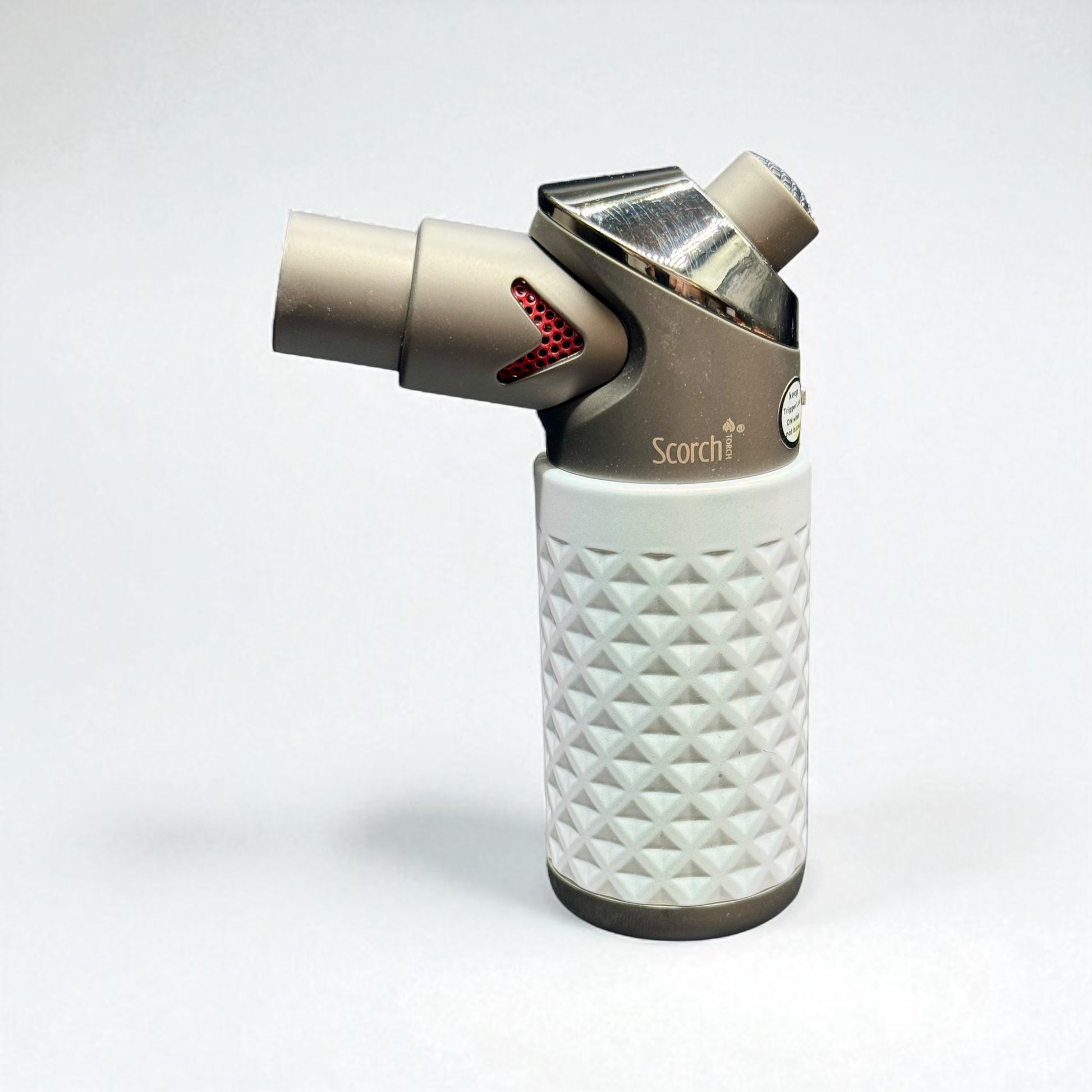 Butane lighter with diamond pattern on a white background