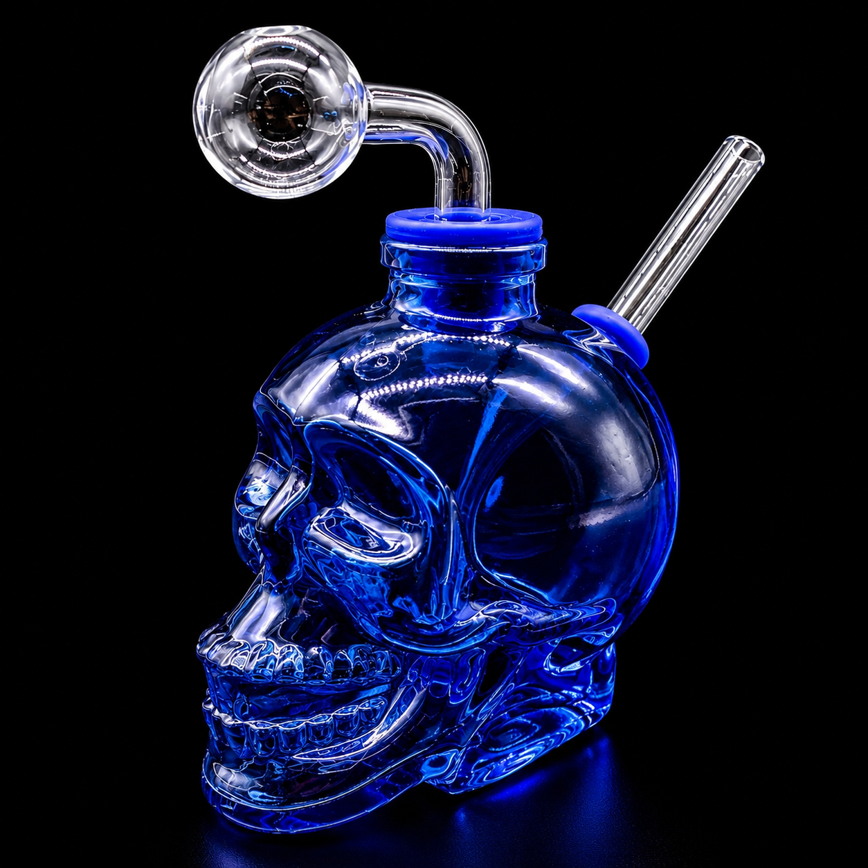Blue glass skull with smoking apparatus on a black background