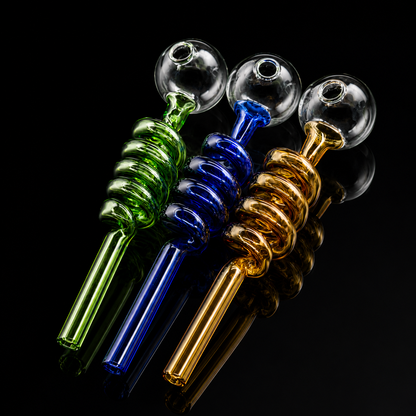 Three glass吸烟器, one green, one blue, and one gold, on a black background.