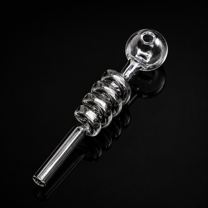 Clear glass smoking pipe on a black background