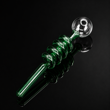 Green glass pipe with twisted design on a black background