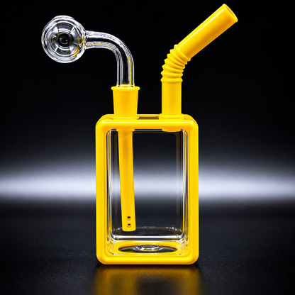 Yellow glass smoking device with a clear square base on a black background