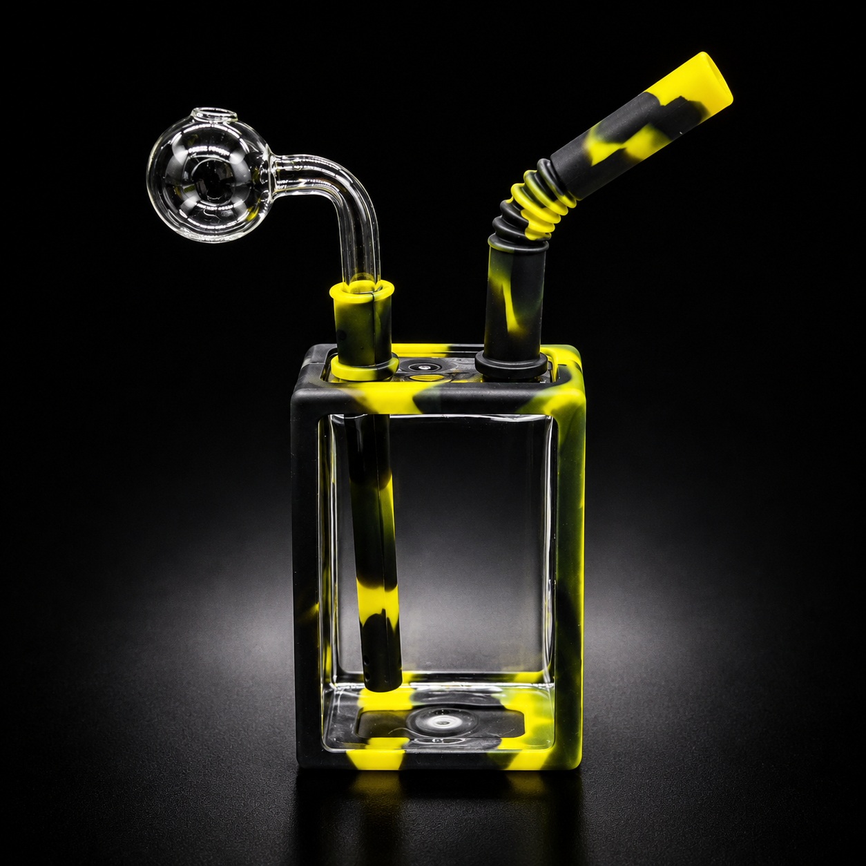 Glass smoking device with yellow and black pattern on a black background