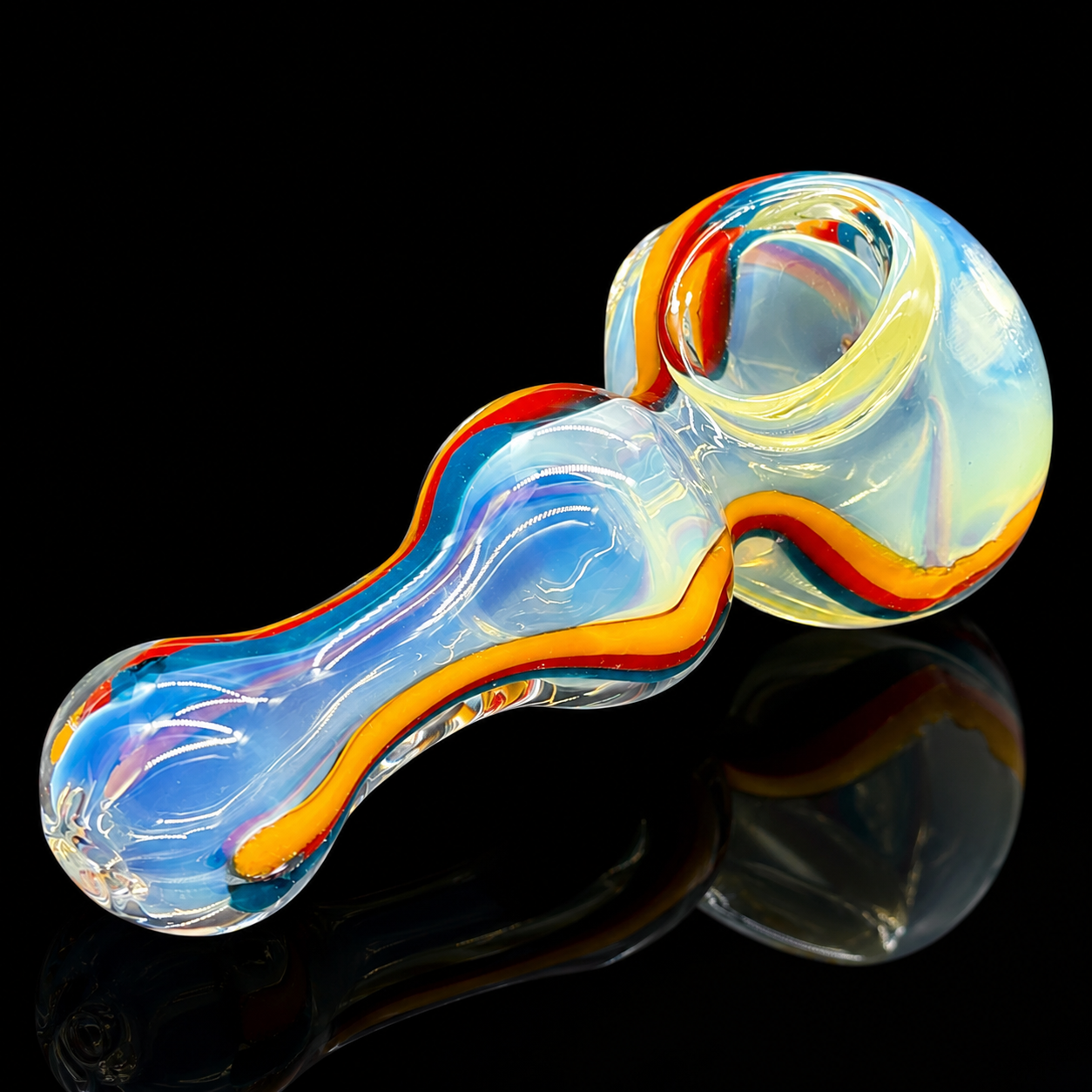 Colorful glass smoking pipe on a black background
