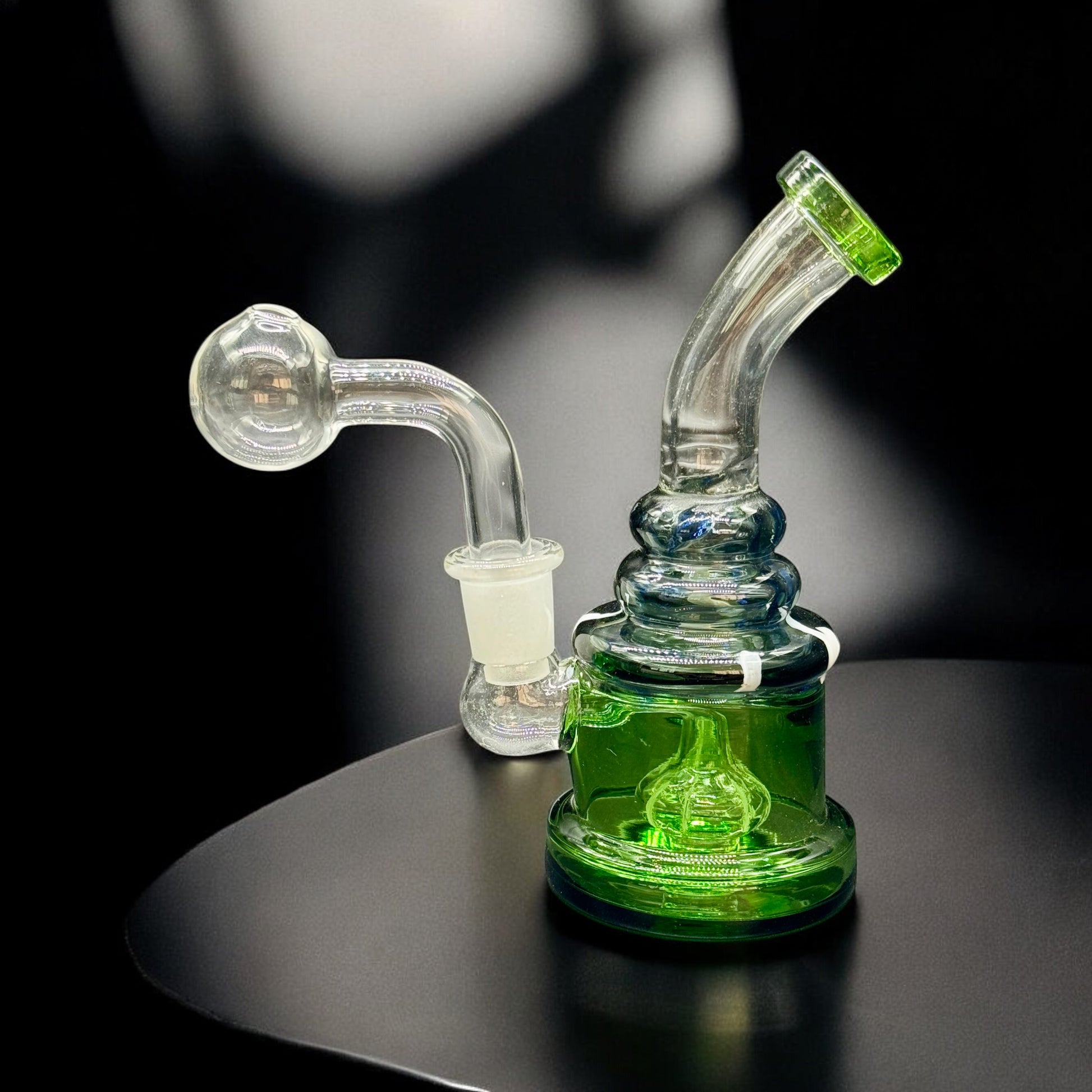 Mini blue and gold oil burner water pipe with removable glass bubble bowl, shown disassembled on a flat surface