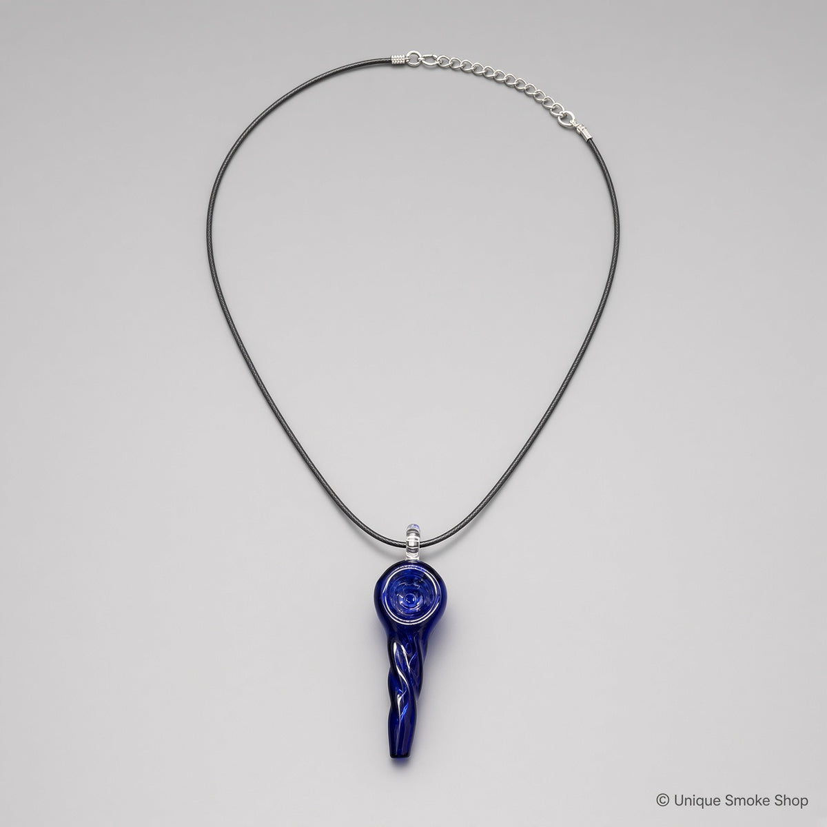 Mini hand-blown cobalt blue glass pipe necklace with twisted spiral design on black cord