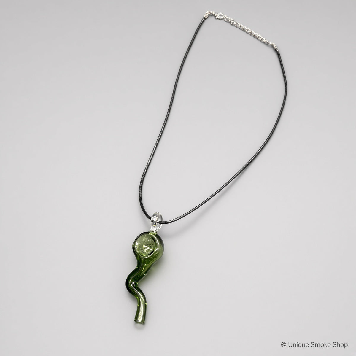 Mini hand-blown green glass pipe necklace with wavy squiggle design on black cord