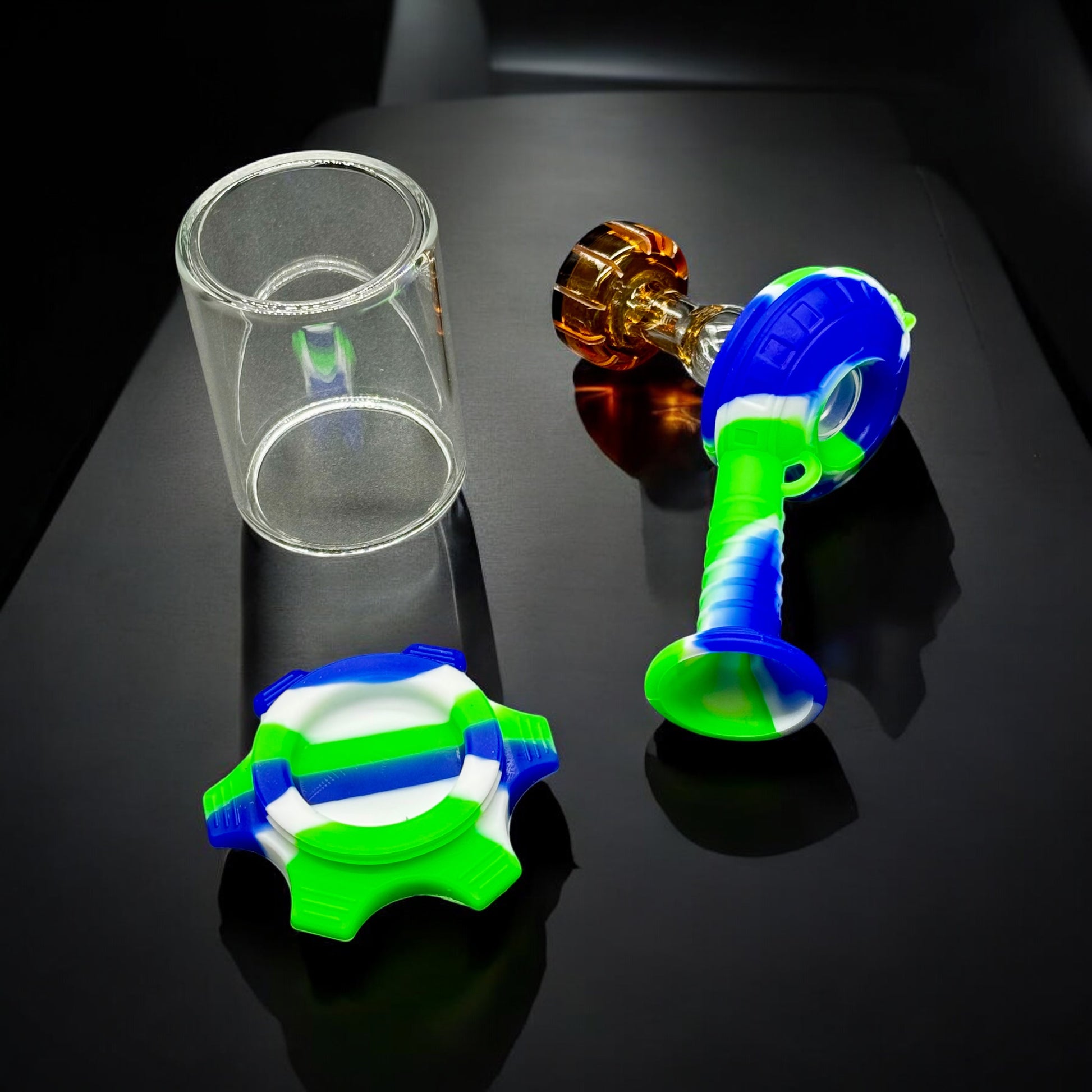 Breakdown of the mini silicone and glass oil burner water pipe showing removable parts and glass chamber