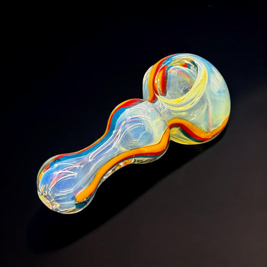 Rainbow swirl glass hand pipe front angle showing fumed color and deep bowl.