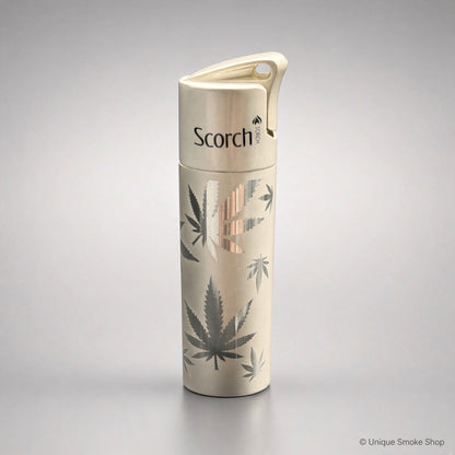 Scorch Torch 61838 cream metal single-flame lighter with cannabis leaf pattern, front view, 3 inches tall.