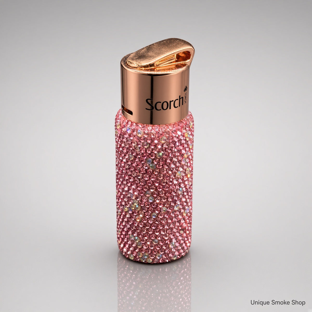 Pink rhinestone Scorch 61892 torch lighter top three-quarter view showing rose gold lid and Scorch logo