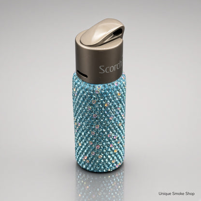 Teal rhinestone Scorch 61892 torch lighter top three-quarter view showing gunmetal lid and Scorch logo