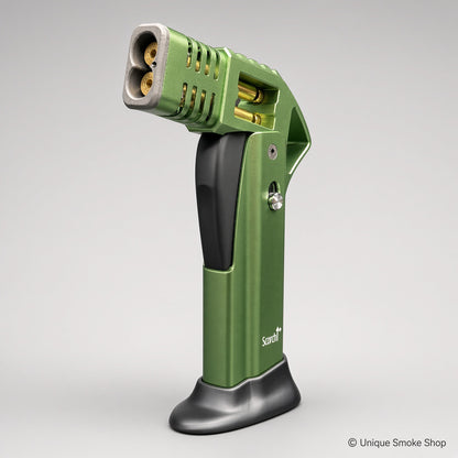 ALT: Green Scorch Torch Lighter with gold accents, side view standing on base – Unique Smoke Shop