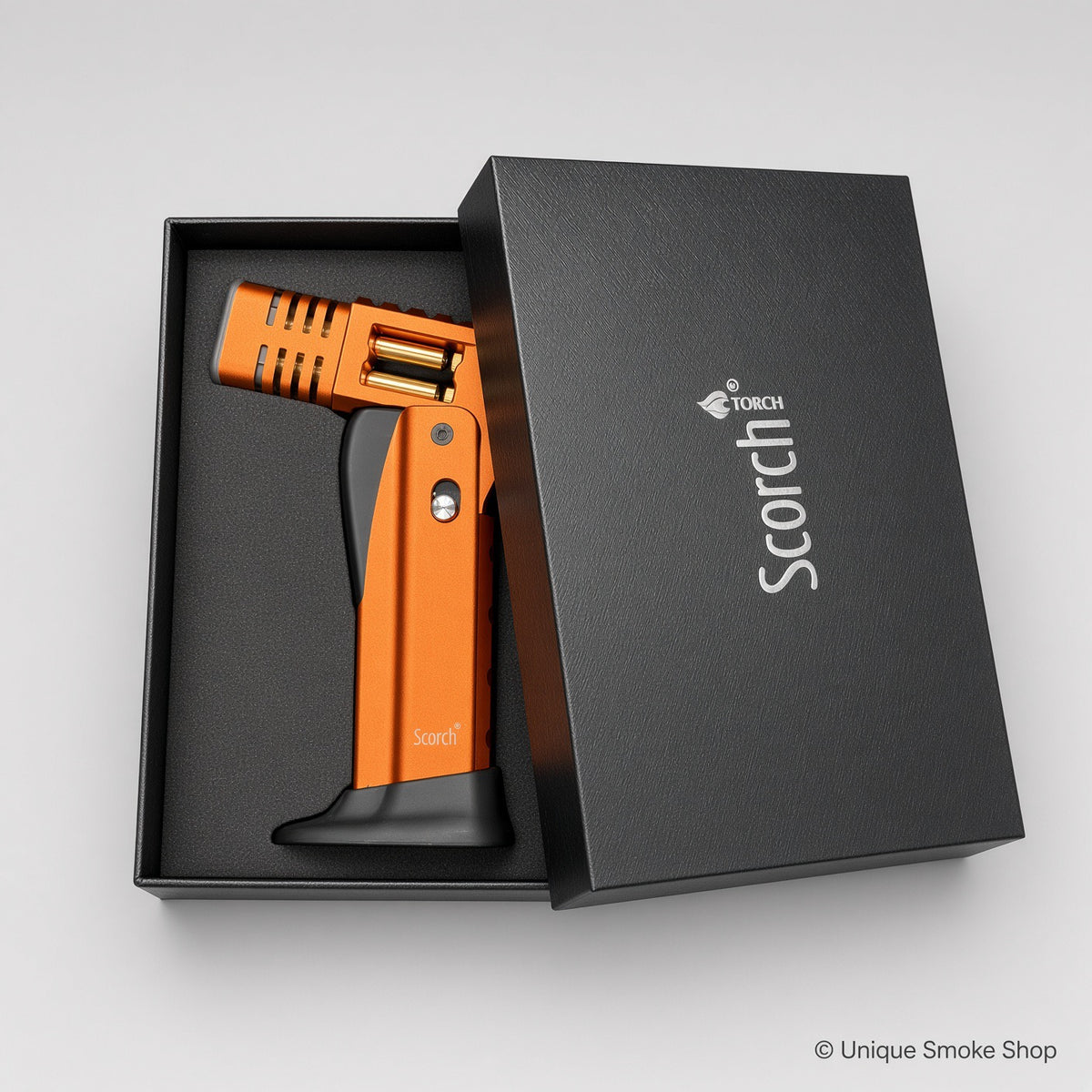 Orange Scorch Torch Lighter in open black gift box with Scorch TORCH logo – Unique Smoke Shop