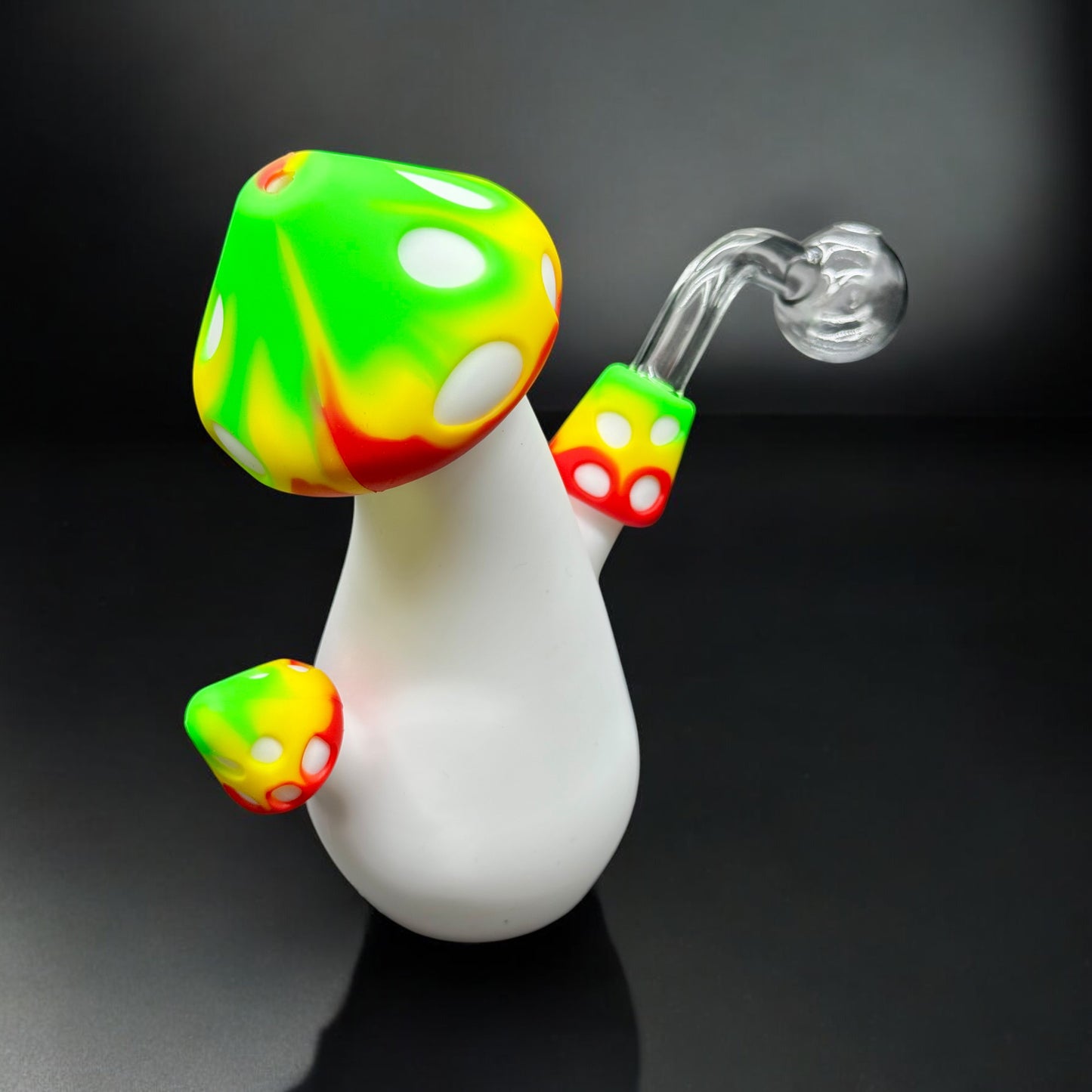 Angled view of Rasta mushroom water pipe showing side stems