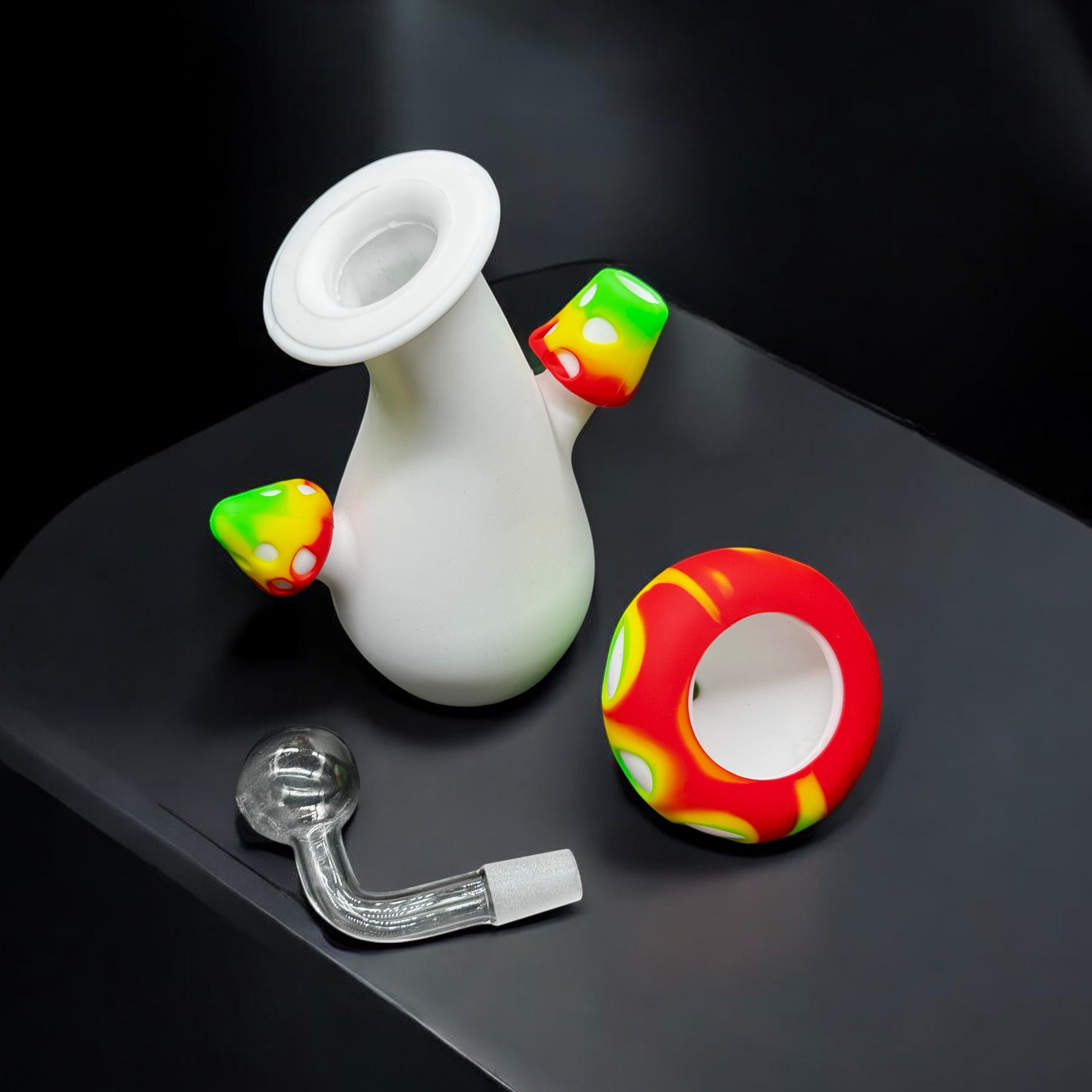 Mushroom silicone pipe shown with parts separated: body, slide, and top cap