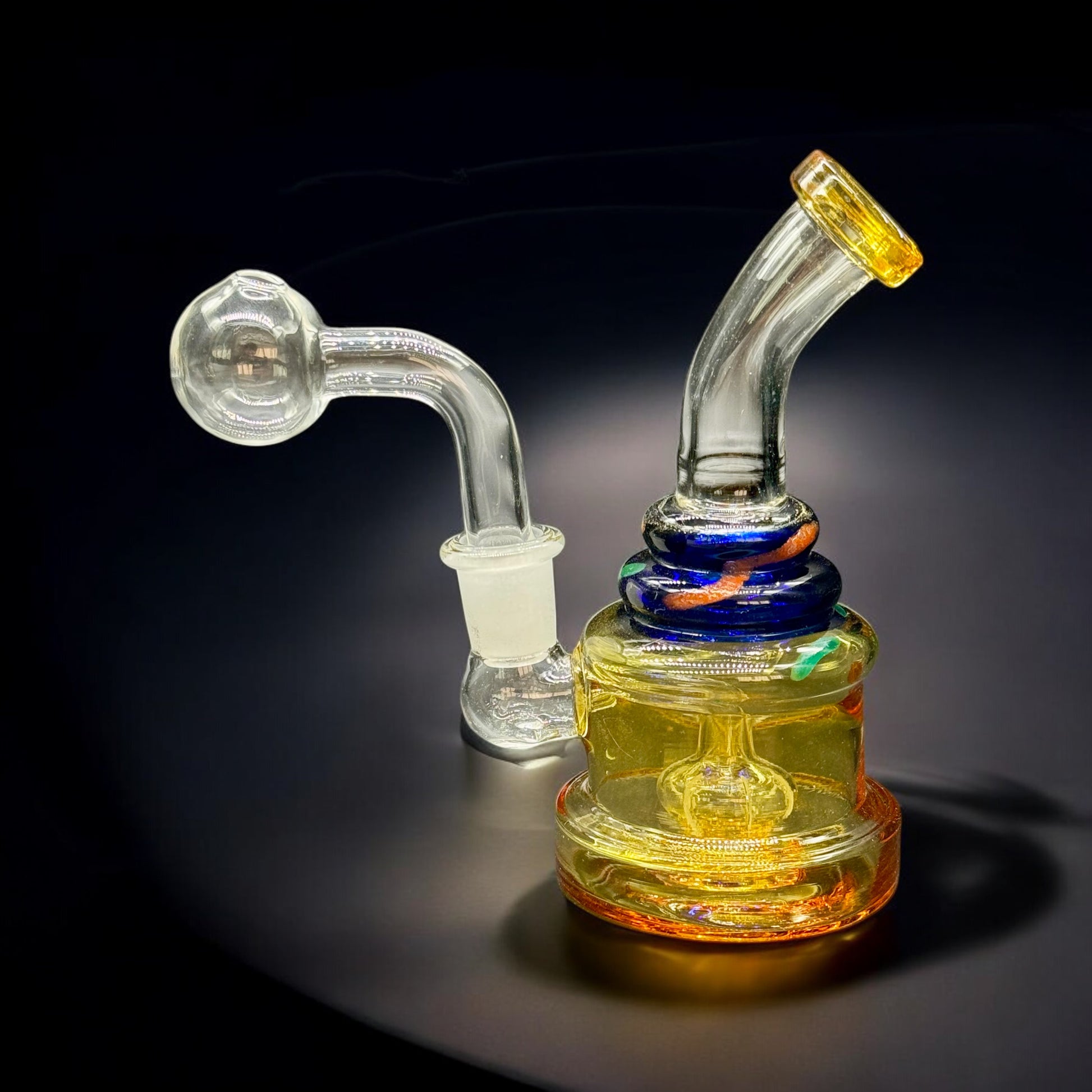 Compact 5.5 inch yellow and orange mini glass oil burner water pipe with curved neck and glass bubble bowl attachment